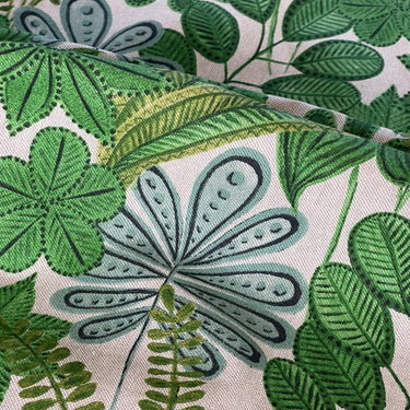 Linen-look green leaf fabric with botanical pattern